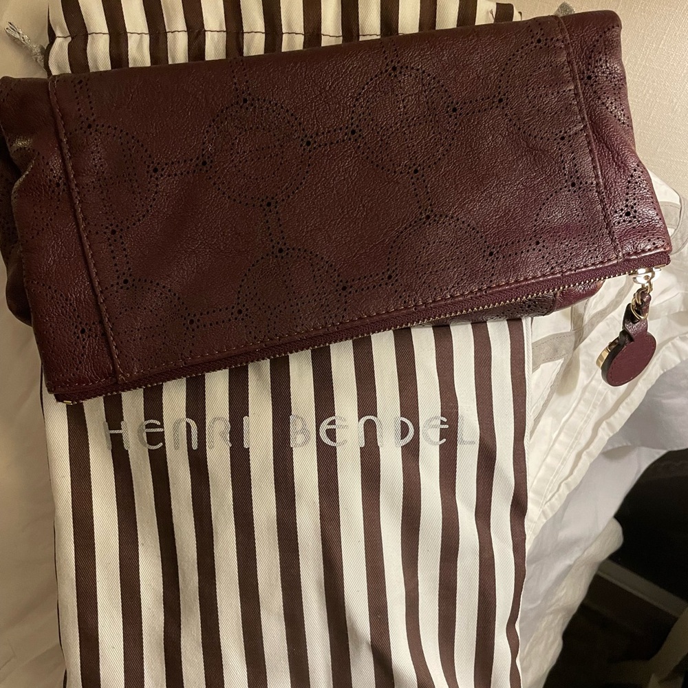 Henri Bendel Burgandy fold clutch with gold zipper! Authentic.
